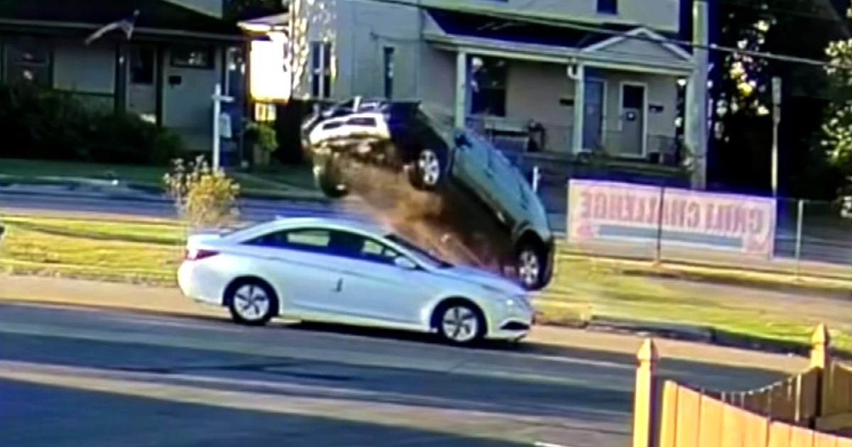 suv-flying-over-car