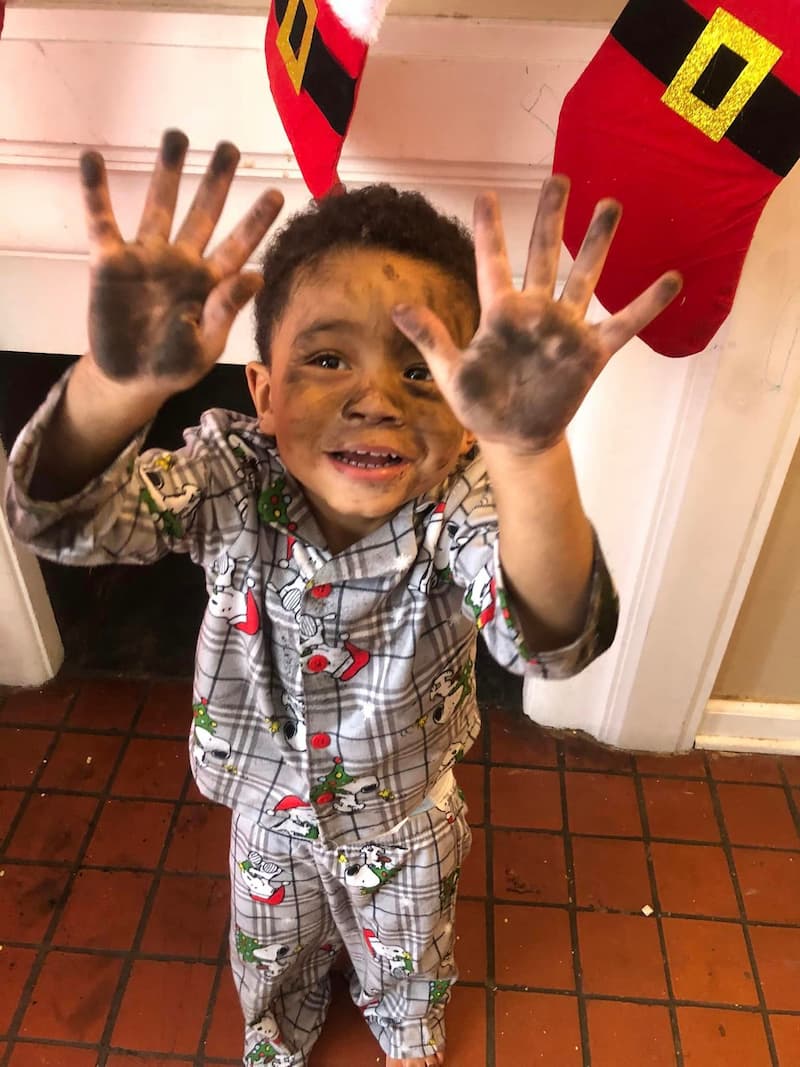 boy-looking-for-santa-in-chimney