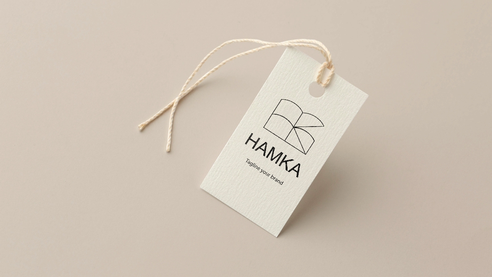 Jasa desain logo online dengan tagline "Tagline your brand", logo berbentuk buku terbuka