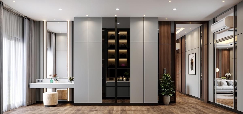 Desain interior ruangan minimalis dengan lemari kaca dan meja rias modern, cocok untuk apartemen atau rumah kecil.