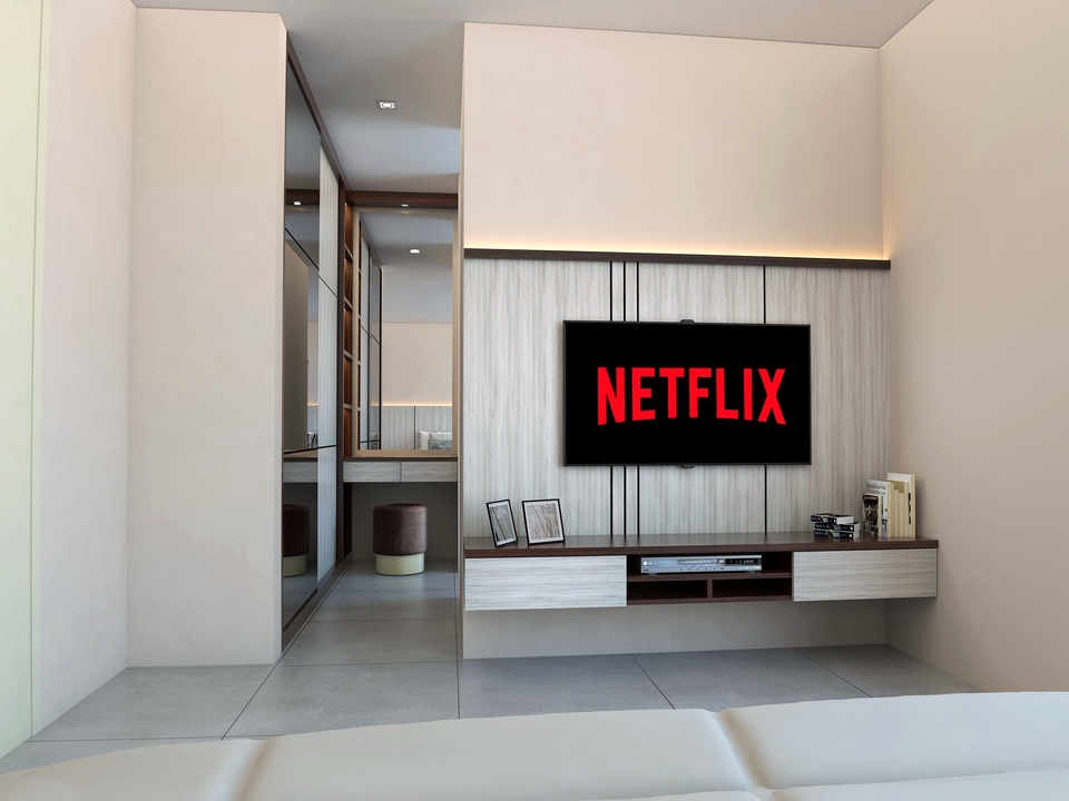 Jasa desain interior rumah minimalis modern dengan ruang tamu dan televisi layar datar.