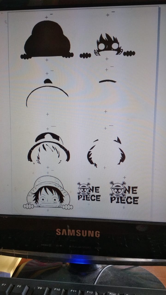 Desain kaos custom dengan motif One Piece, jasa desain kaos distro di Indonesia.