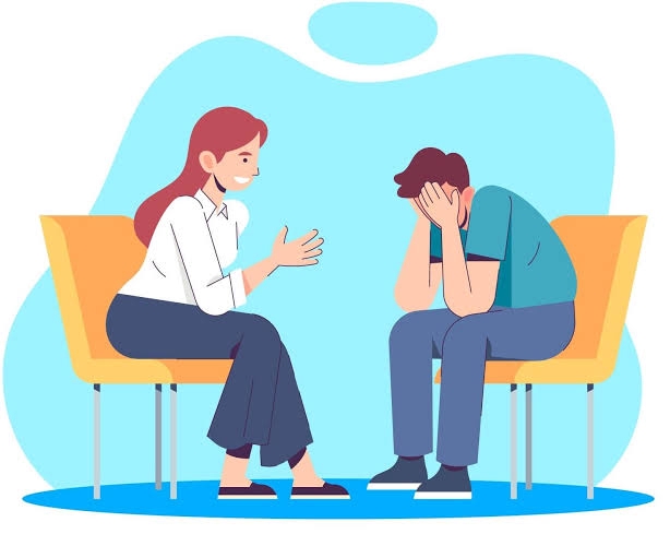 Seorang konselor profesional memberi dukungan kepada kliennya yang mengalami kesulitan