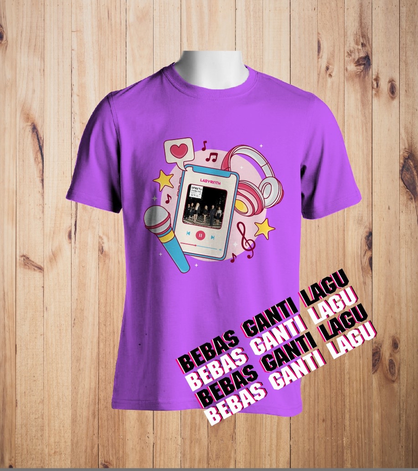 Desain kaos distro dengan motif gambar musik dan tulisan "Bebas Ganti Lagu" cocok untuk desain kaos pria dan wanita.