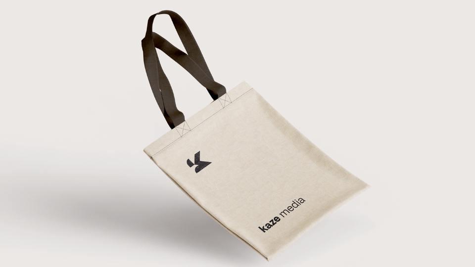 Jasa desain logo profesional dengan logo minimalis dan teks "kaze media" di bawahnya.