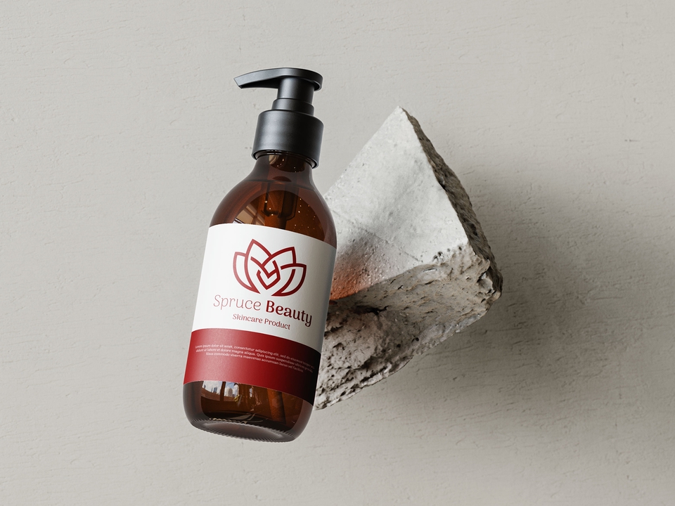 Jasa desain kemasan botol produk kecantikan dengan logo daun hijau dan tulisan Spruce Beauty.