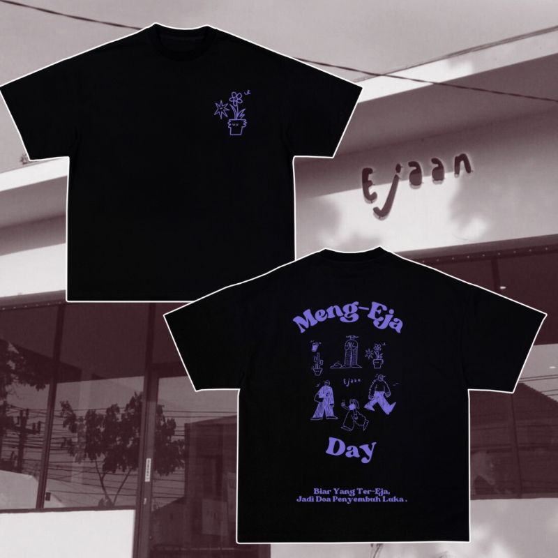 Desain kaos custom dengan motif tumbuhan dan tulisan Meng-Eja Day. Jasa desain kaos online.