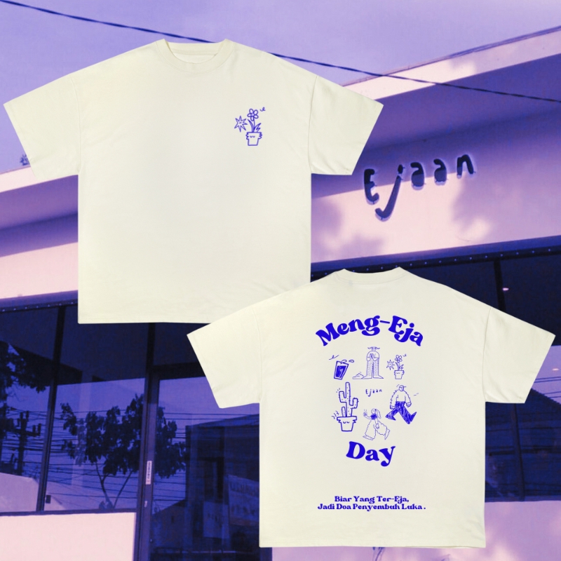 Desain kaos distro dengan desain motif tanaman dan tulisan Meng-Eja Day