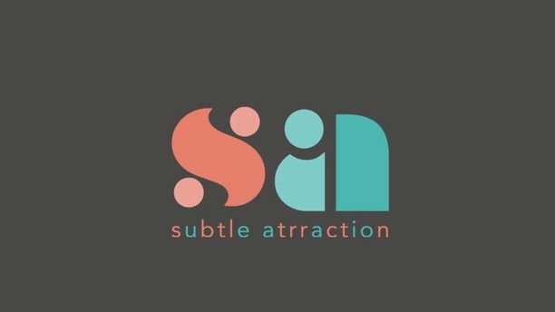 Logo "SA" berwarna merah muda dan biru muda, melambangkan "subtil attraction" - logo design perusahaan.