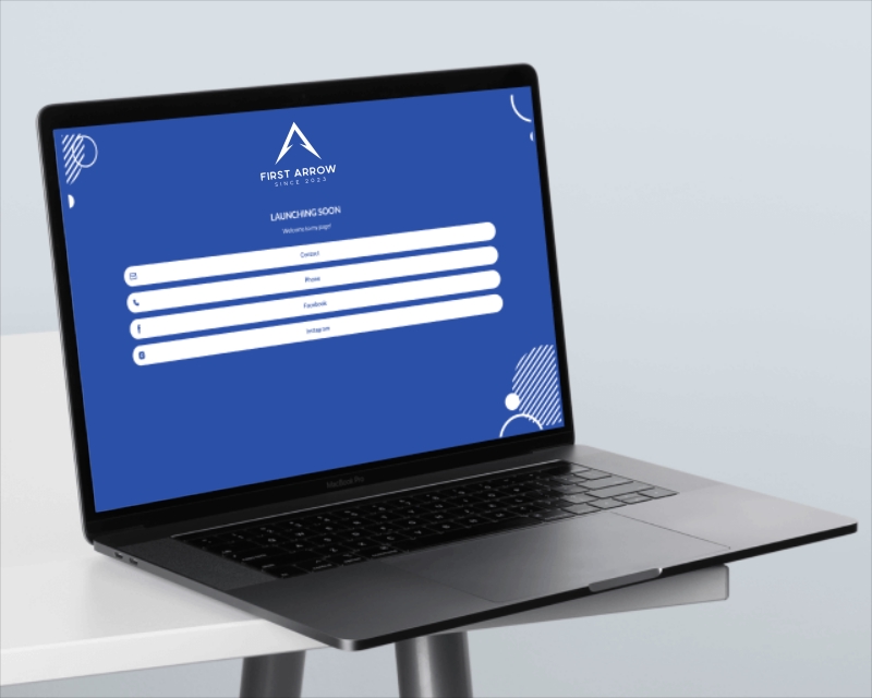 Desain logo laptop dengan background biru dan tulisan "First Arrow" dan "Launching Soon"