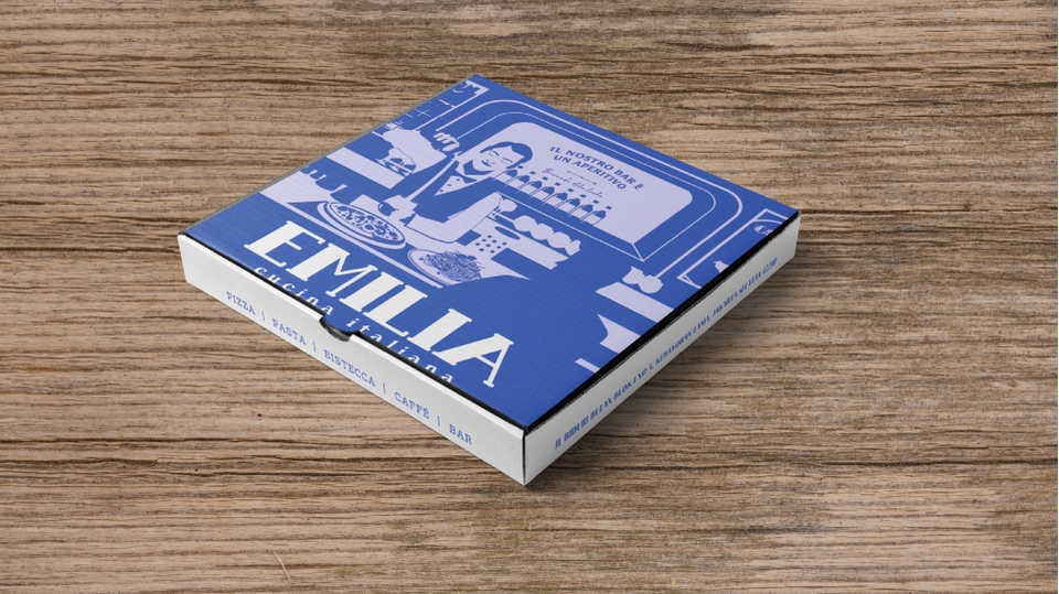 Desain kotak pizza unik dengan gambar pizza dan logo Emilia, cocok untuk jasa desain kemasan makanan.