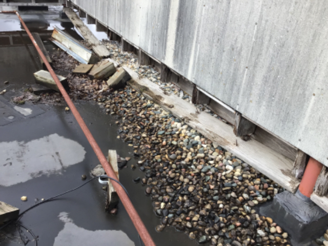 Corrective Action:Repair curtain wall during new roof install phase