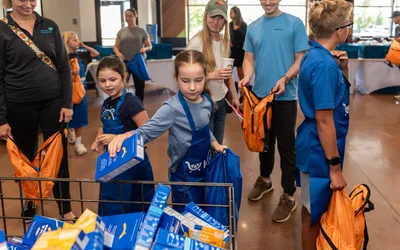 Kids Helping Kids: Backpack Stuffing Volunteer Event