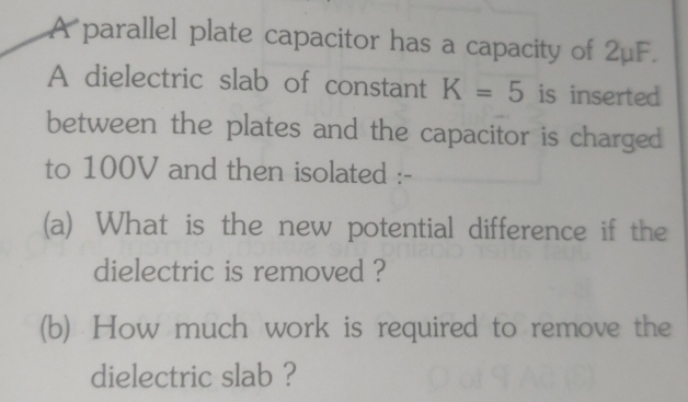 A parallel plate capacitor has a capacity of 2μF. A dielectric slab of