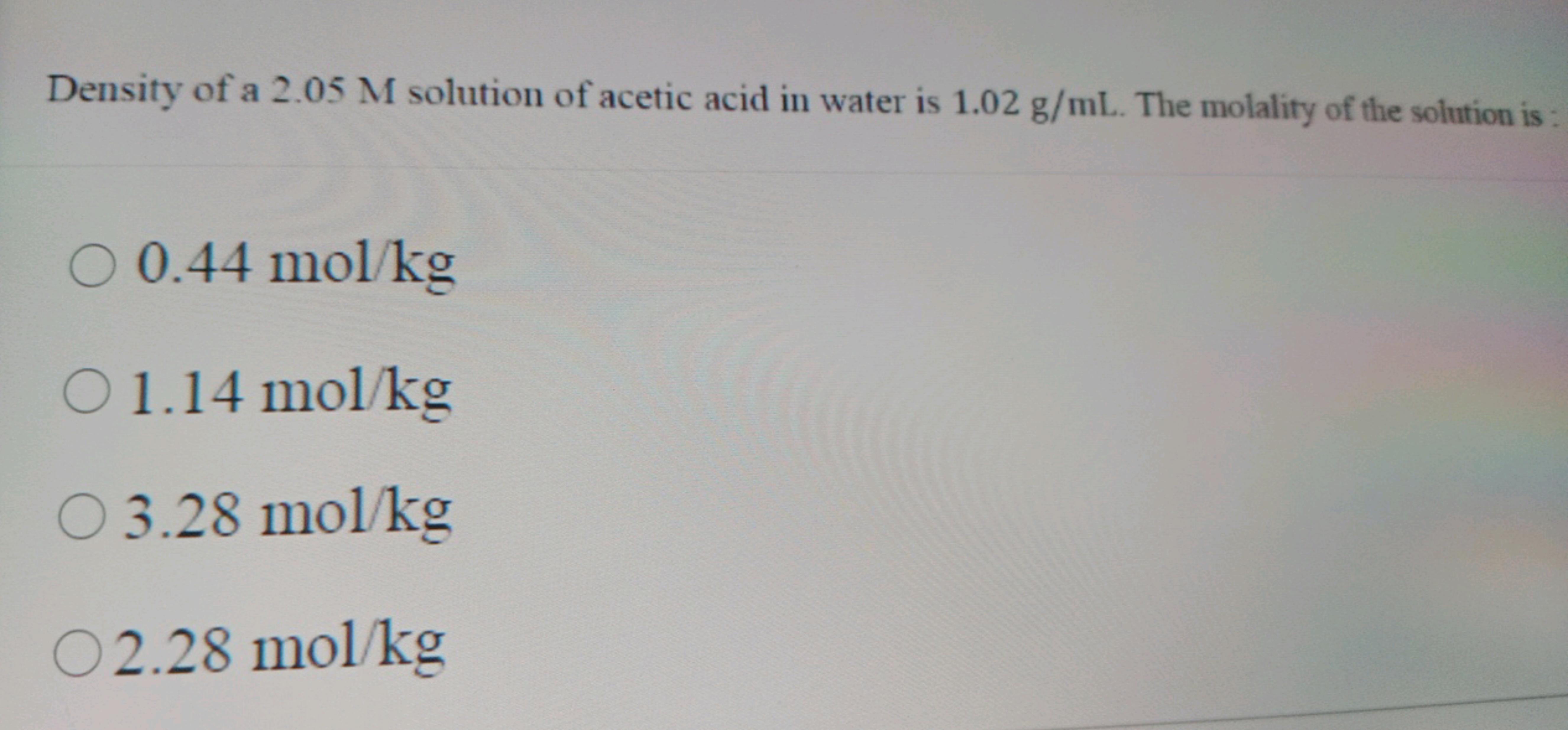 Density of a 2.05 M solution of acetic acid in water is 1.02 g/mL. The