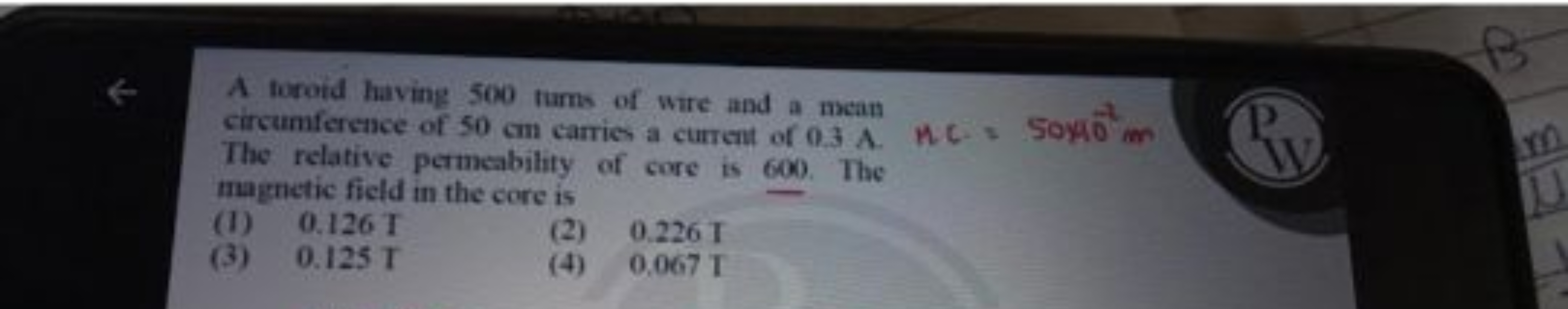 A toroid having 500 turns of wire and a mean circumference of 50 cm ca