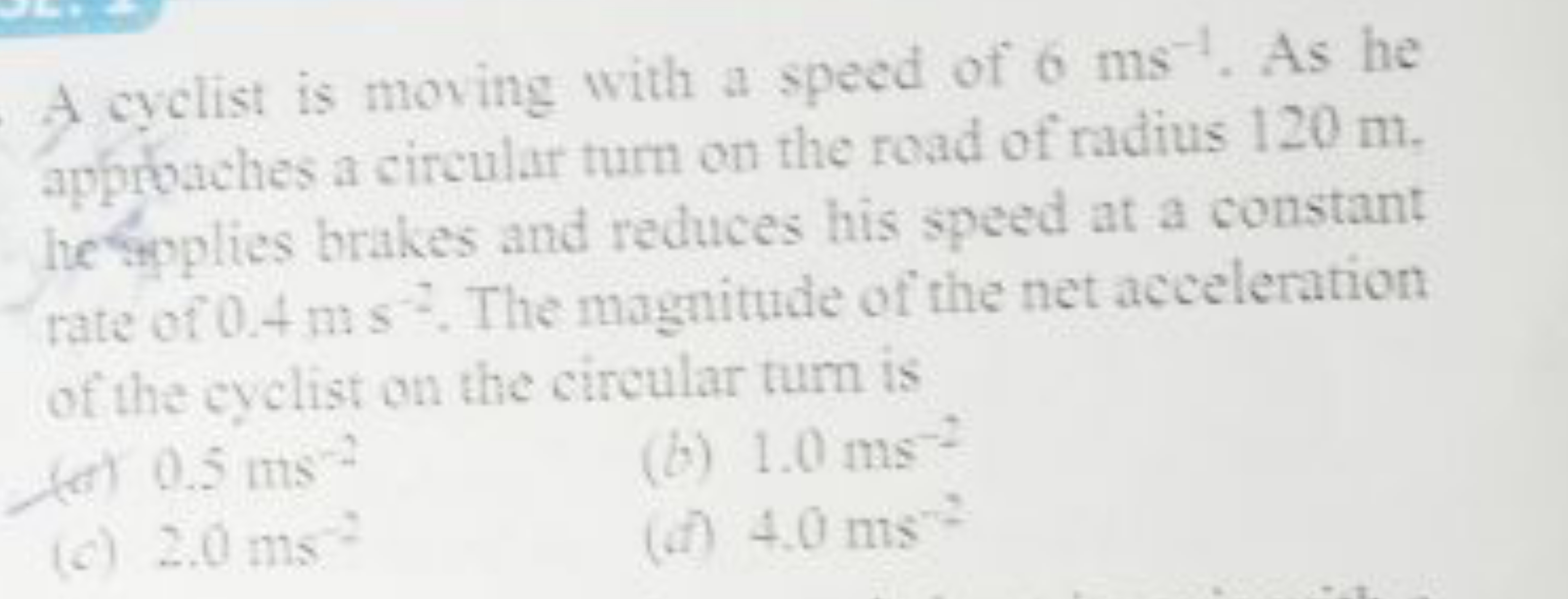 A cyclist is moving with a speed of 6 ms−1. As he appobaches a circula