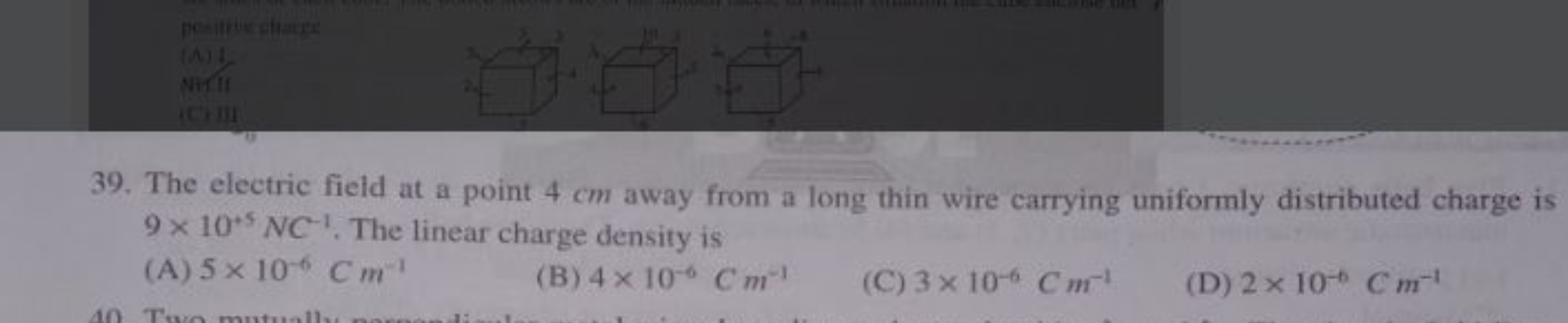 39. The electric field at a point 4 cm away from a long thin wire carr