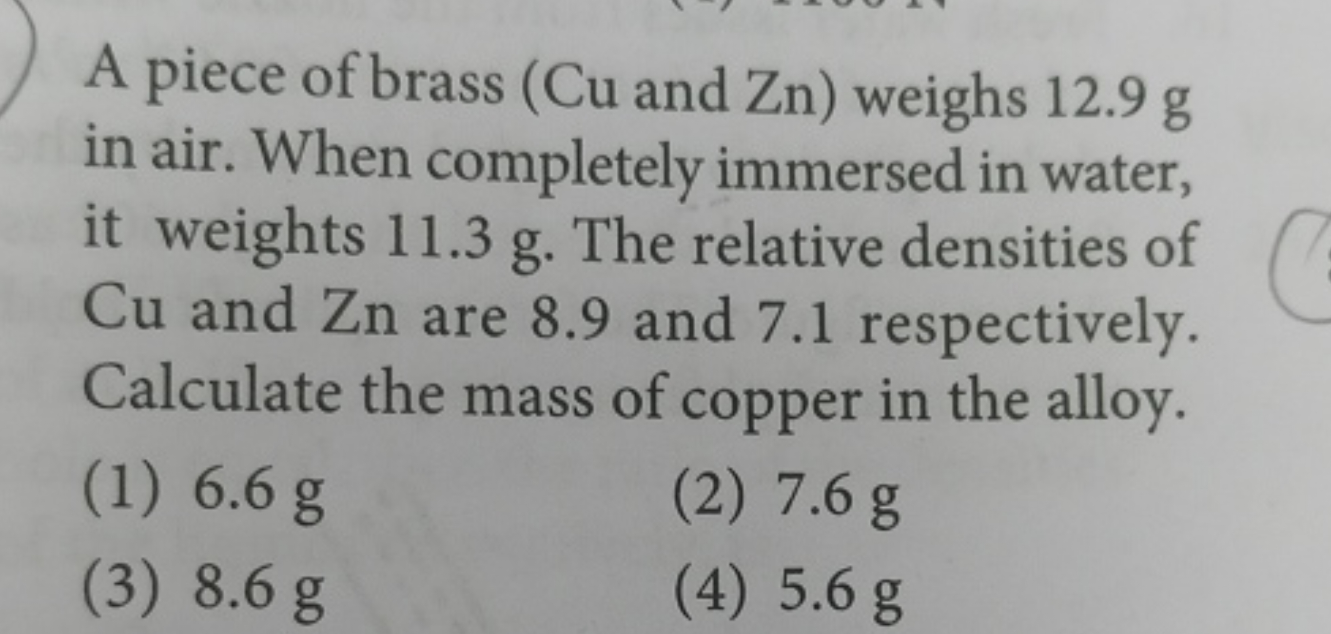 A piece of brass (Cu and Zn) weighs 12.9 g in air. When completely imm