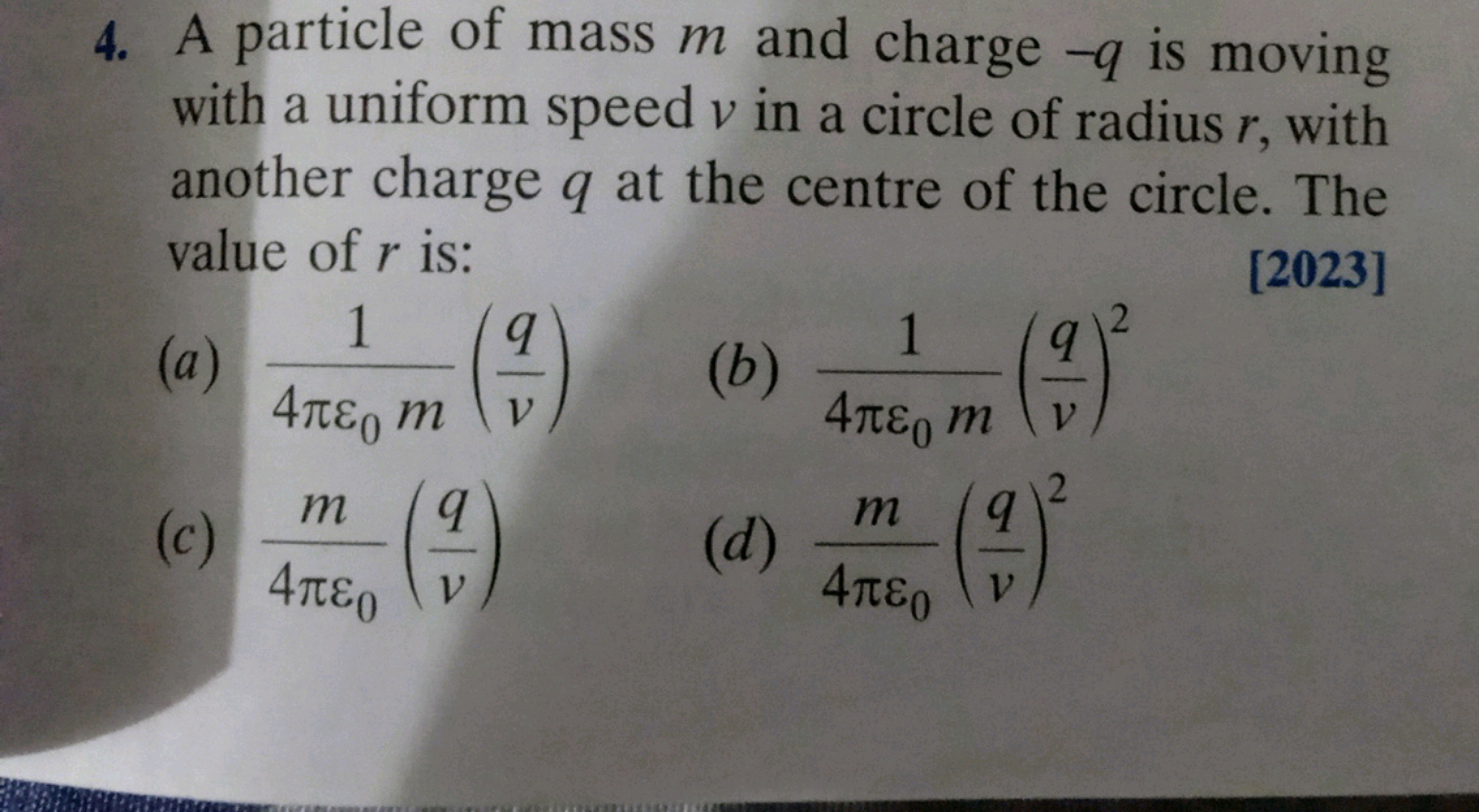 4. A particle of mass m and charge -q is moving
with a uniform speed v