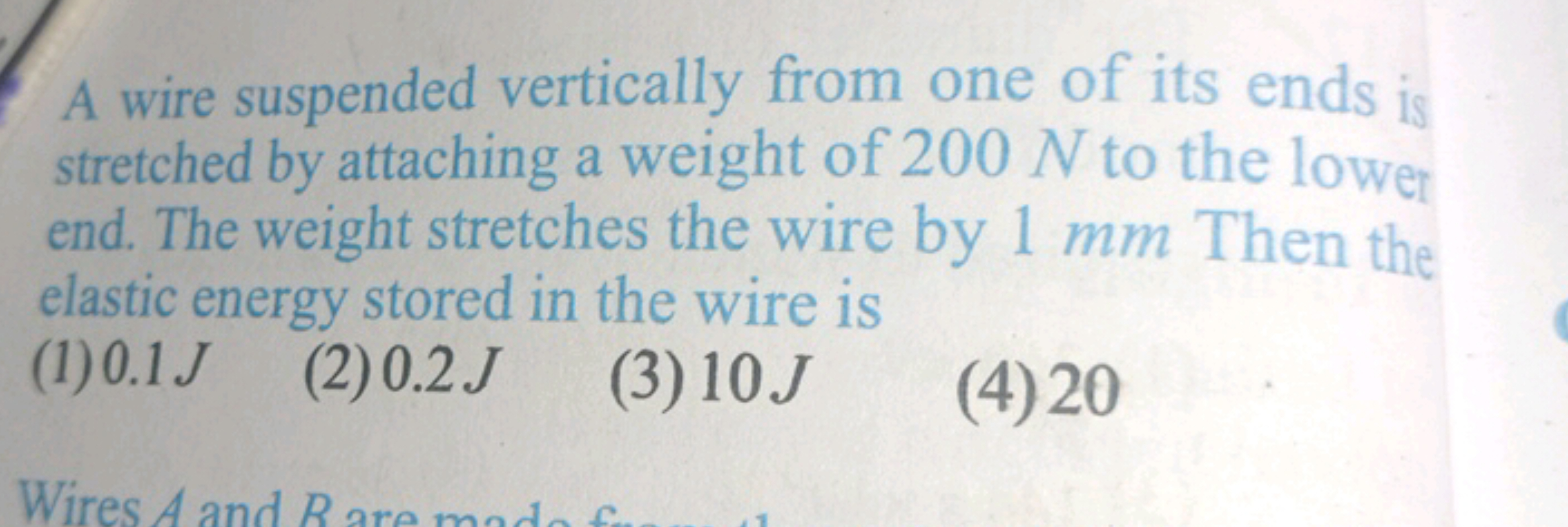 A wire suspended vertically from one of its ends is stretched by attac