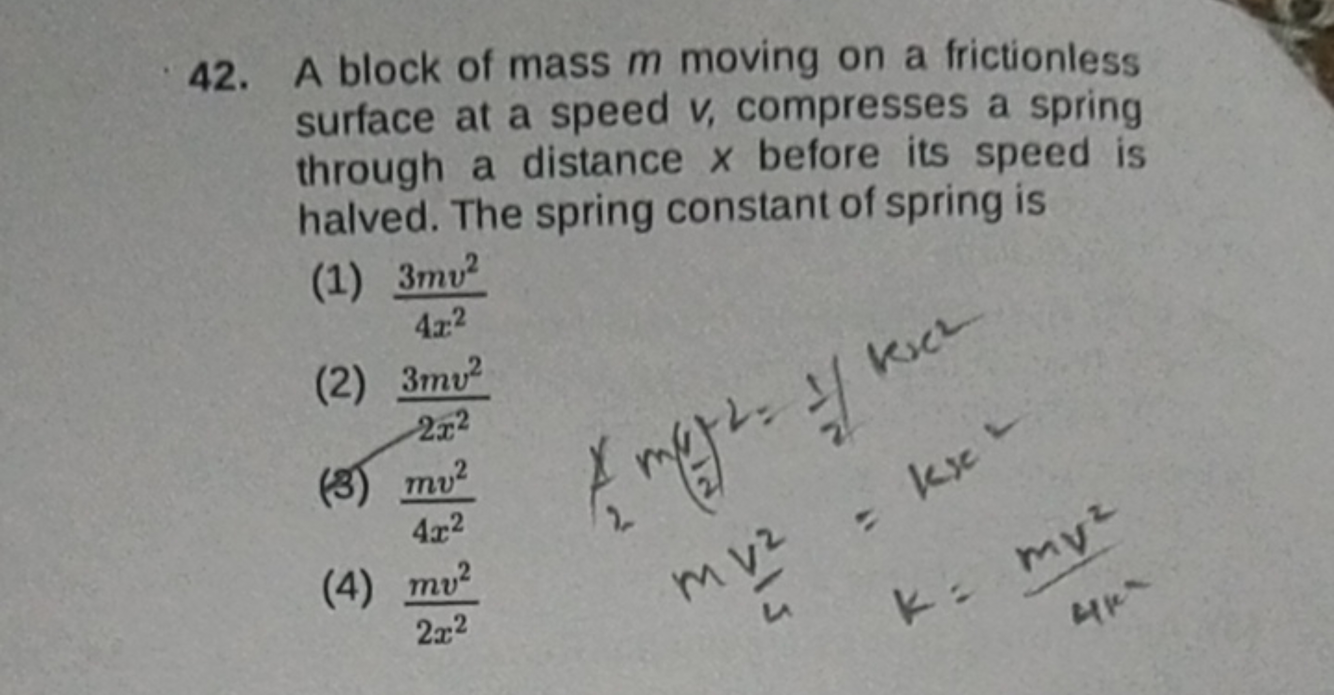 42. A block of mass m moving on a frictionless surface at a speed v, c