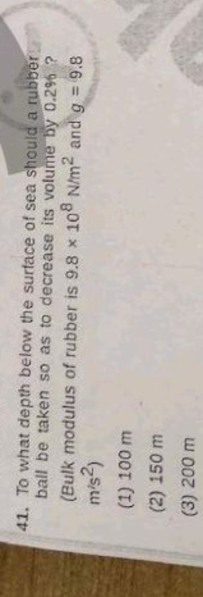 41. To what depth below the surface of sea should a rubber ball be tak