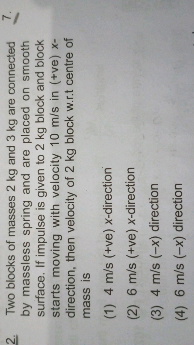 2. Two blocks of masses 2 kg and 3 kg are connected by massless spring