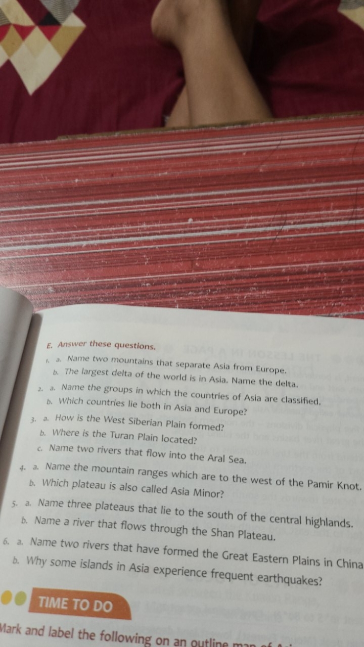 E. Answer these questions.
1. a. Name two mountains that separate Asia