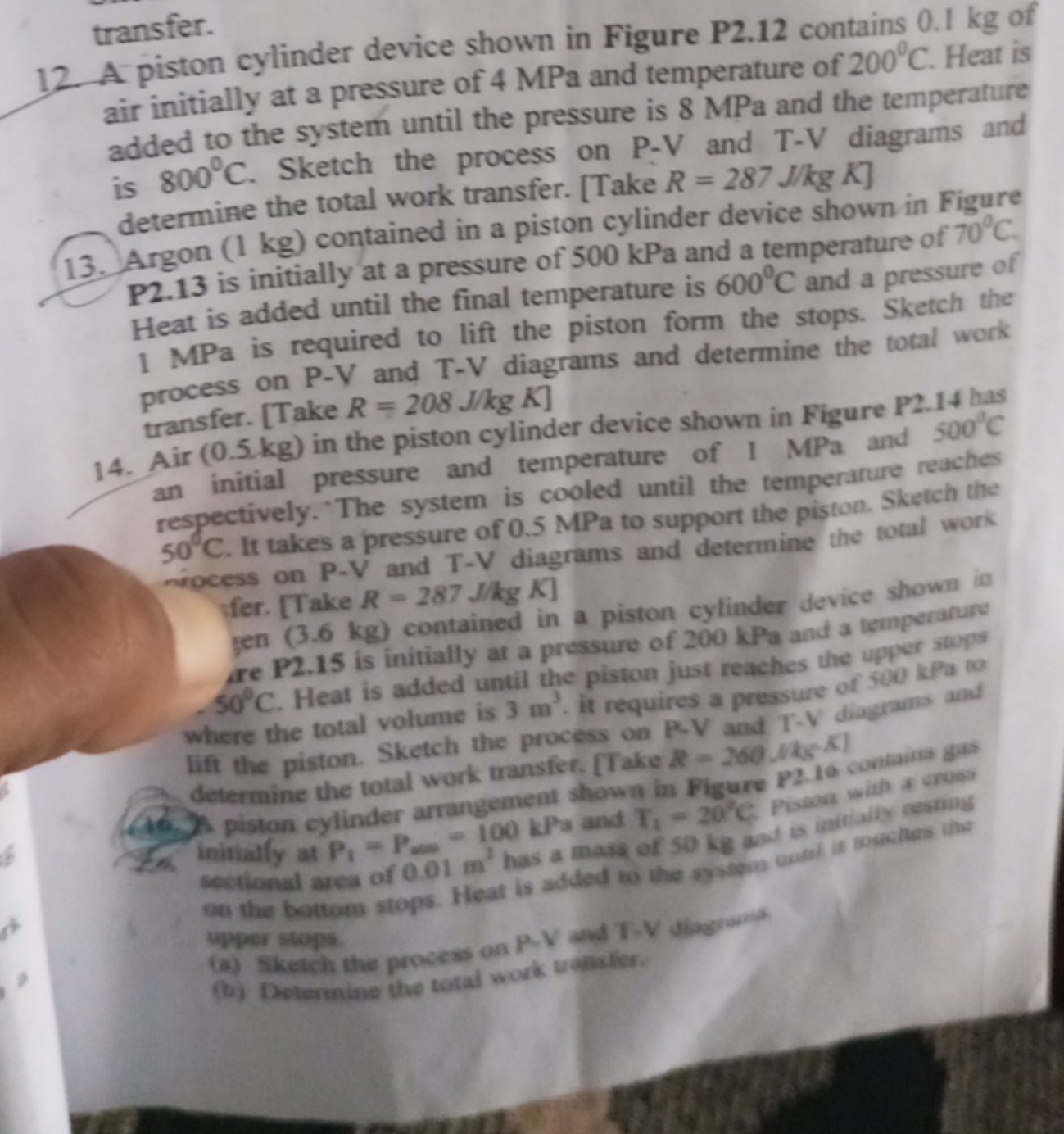 12. A piston cylinder device shown in Figure P2.12 contains 0.1 kg of
