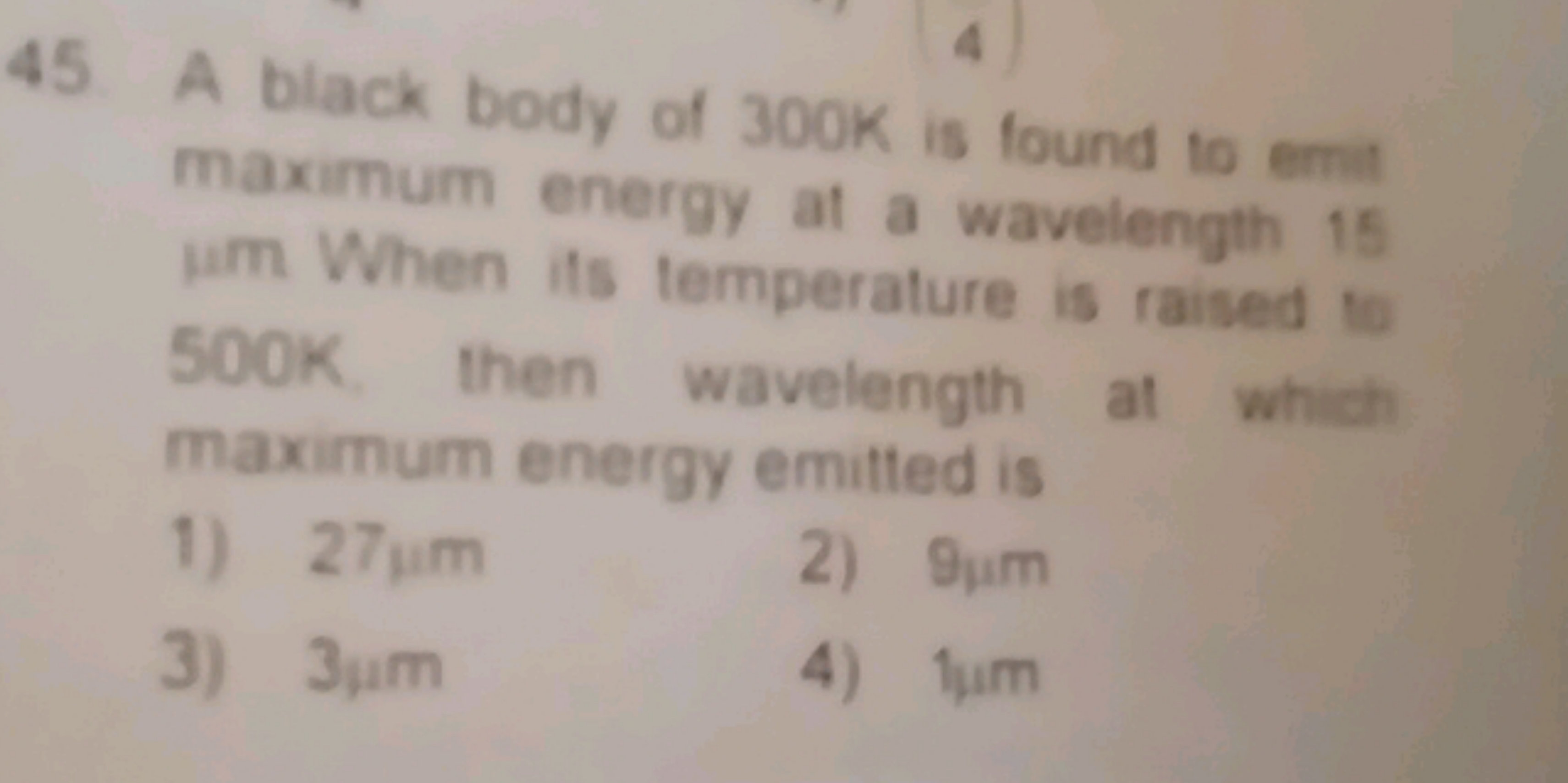 45. A black body of 300 K is found to emi maximum energy at a waveleng