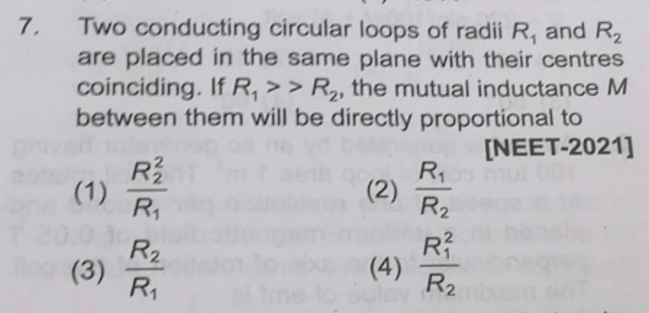 7. Two conducting circular loops of radii R1​ and R2​ are placed in th