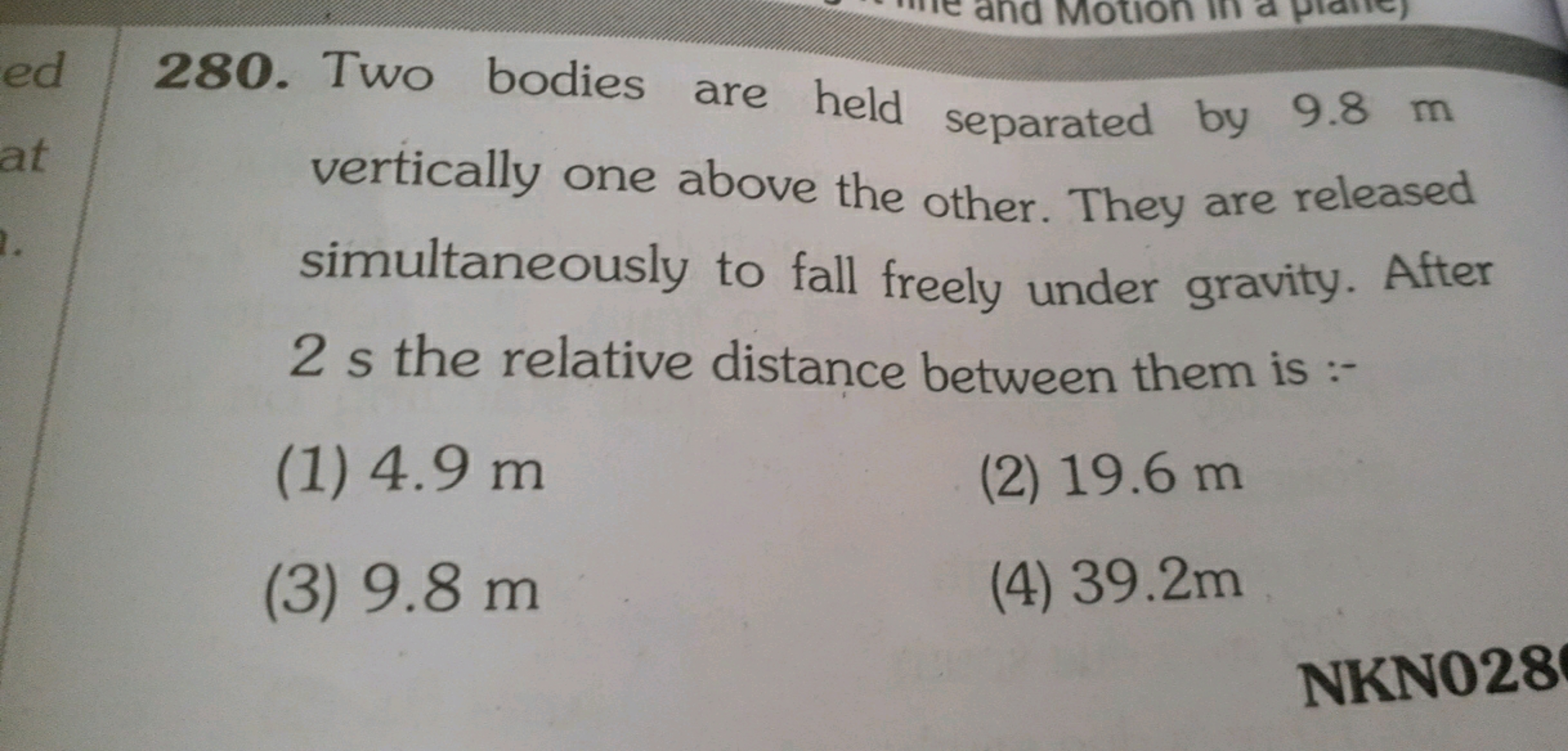 280. Two bodies are held separated by 9.8 m vertically one above the o