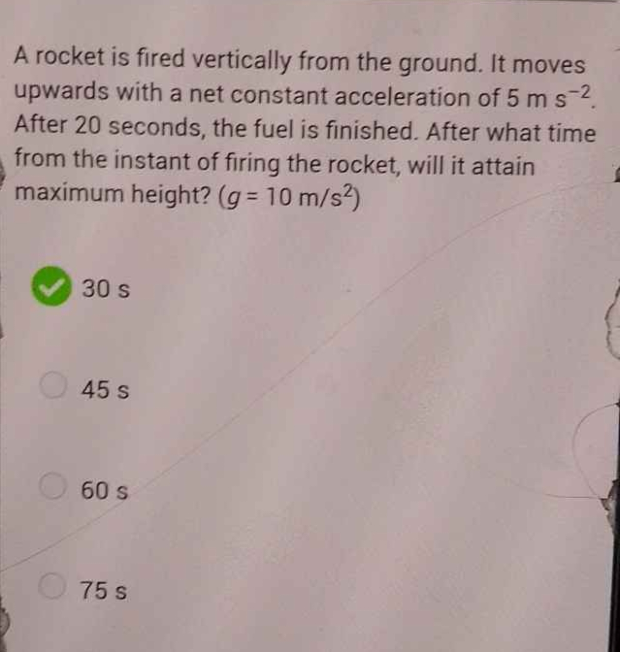 A rocket is fired vertically from the ground. It moves upwards with a 