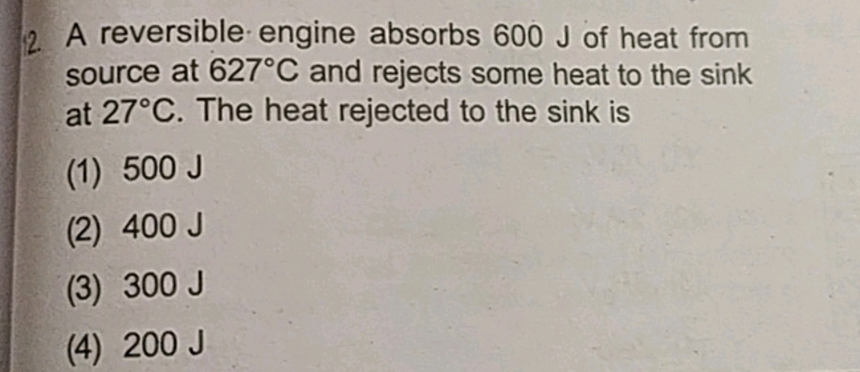 12. A reversible engine absorbs 600 J of heat from source at 627∘C and