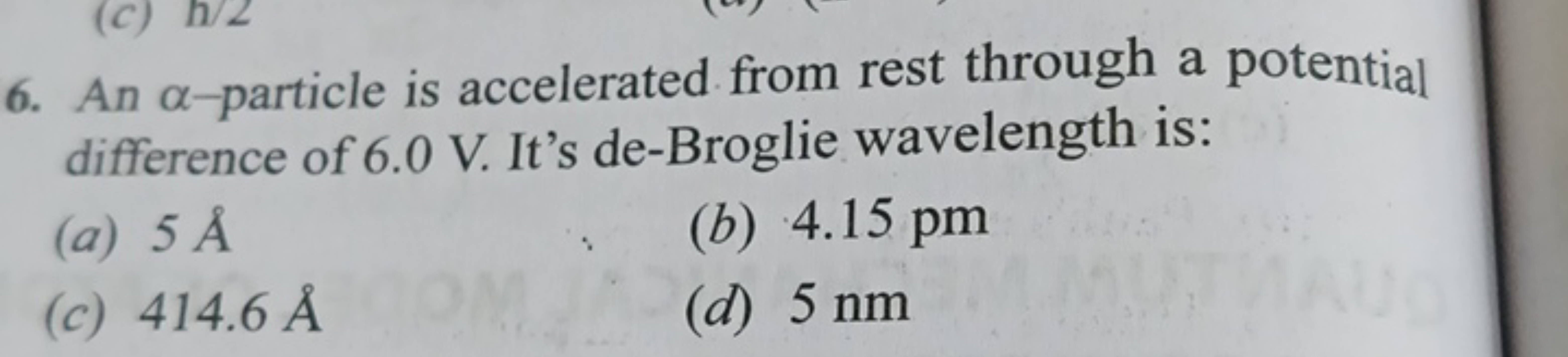 6. An α-particle is accelerated from rest through a potential differen