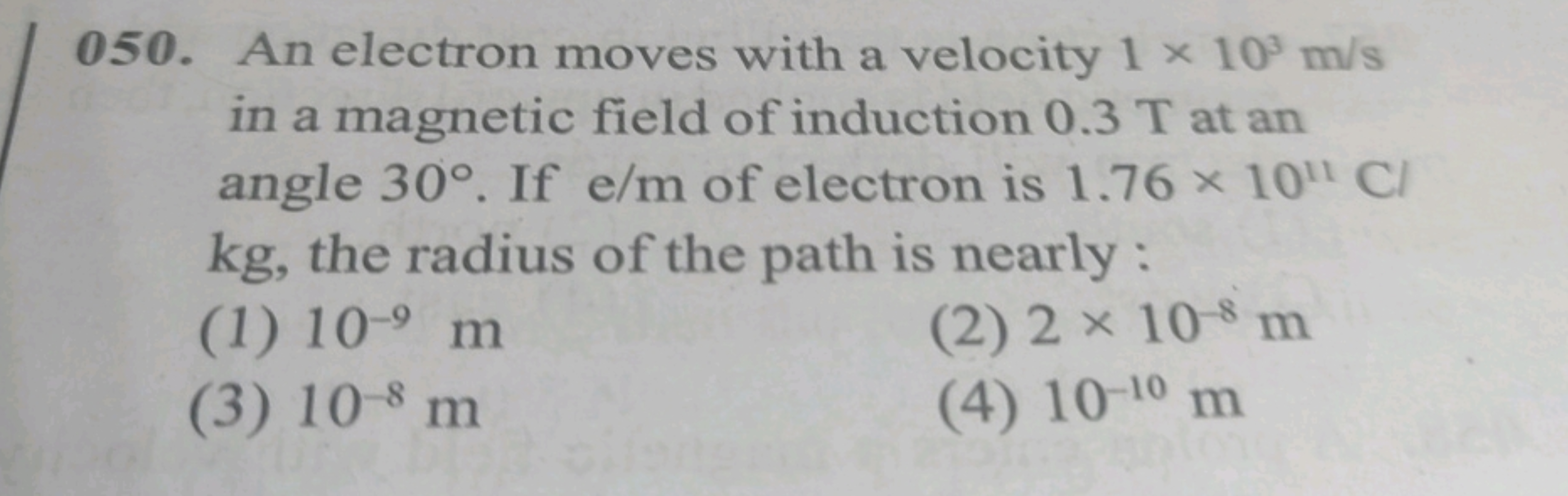 050. An electron moves with a velocity 1×103 m/s in a magnetic field o