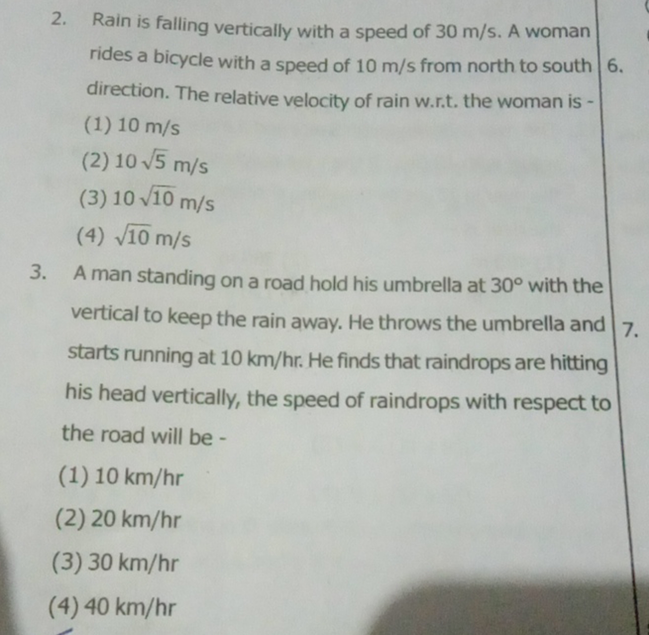 2. Rain is falling vertically with a speed of 30 m/s. A woman rides a 