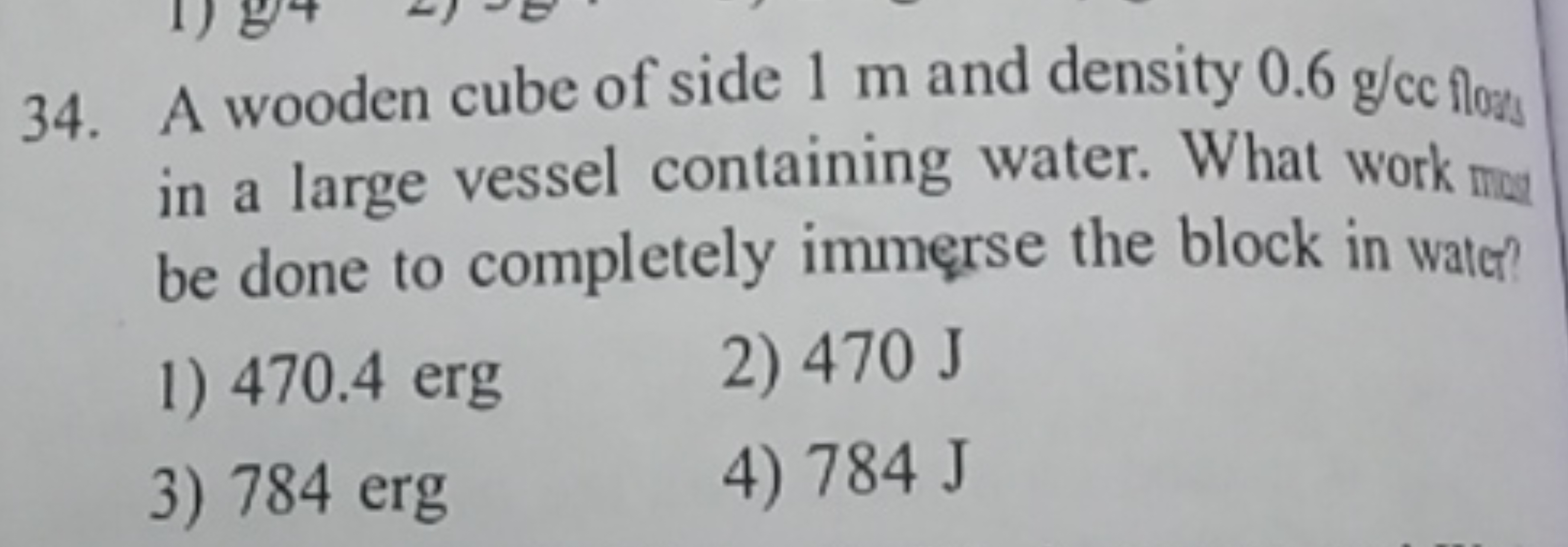 34. A wooden cube of side 1 m and density 0.6 g/cc floms in a large ve