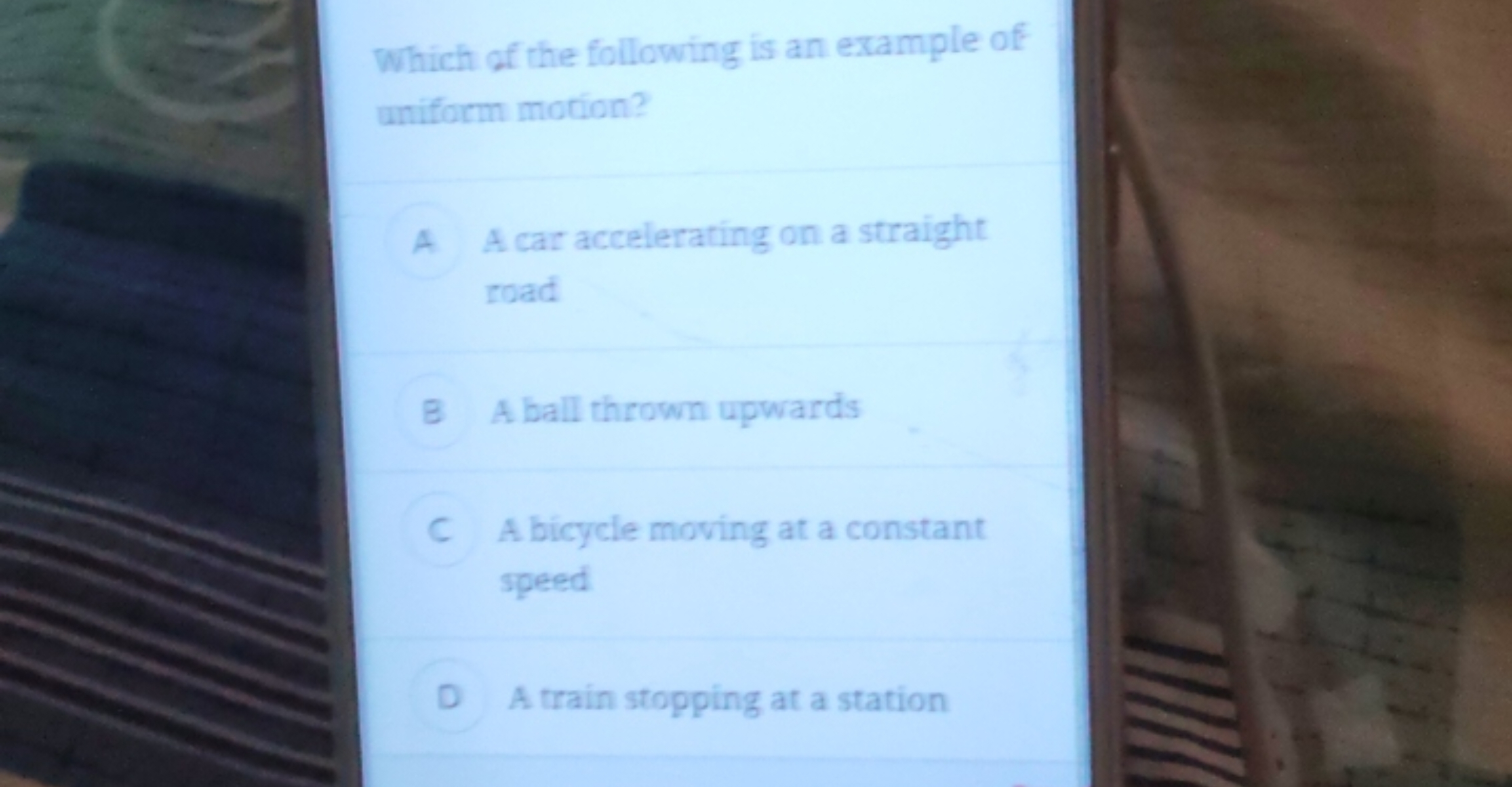 Which of the following is an example of uniform motion?

A A car accel