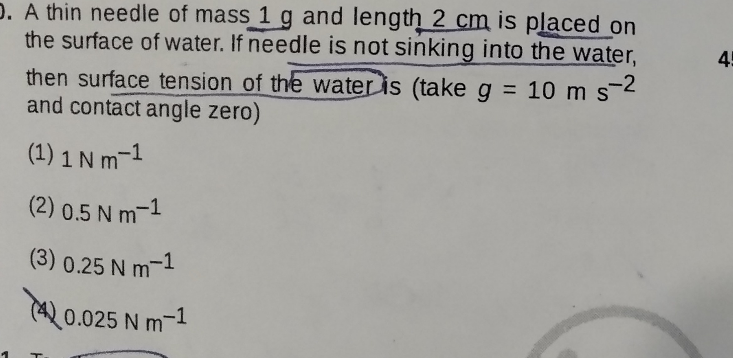 A thin needle of mass 1 g and length 2 cm is placed on the surface of 