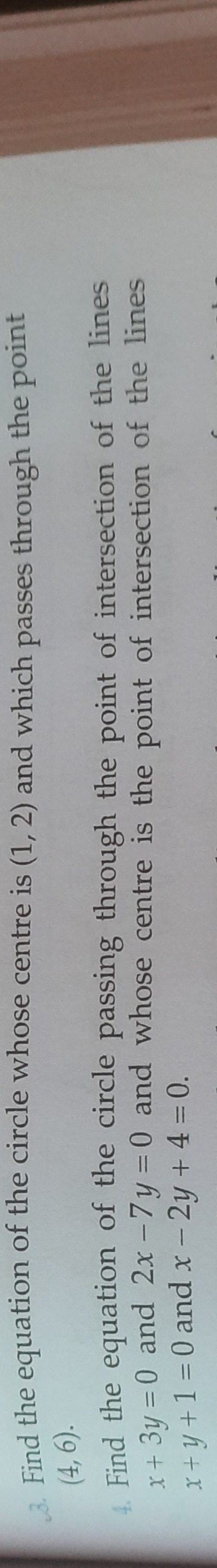 3. Find the equation of the circle whose centre is (1,2) and which pas