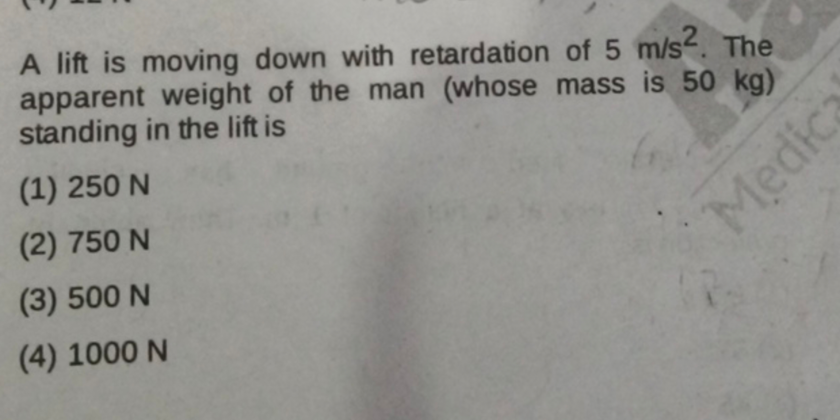 A lift is moving down with retardation of 5 m/s2. The apparent weight 