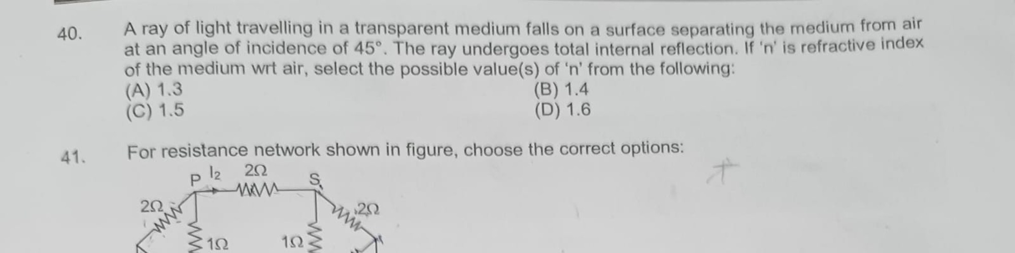 40. A ray of light travelling in a transparent medium falls on a surfa