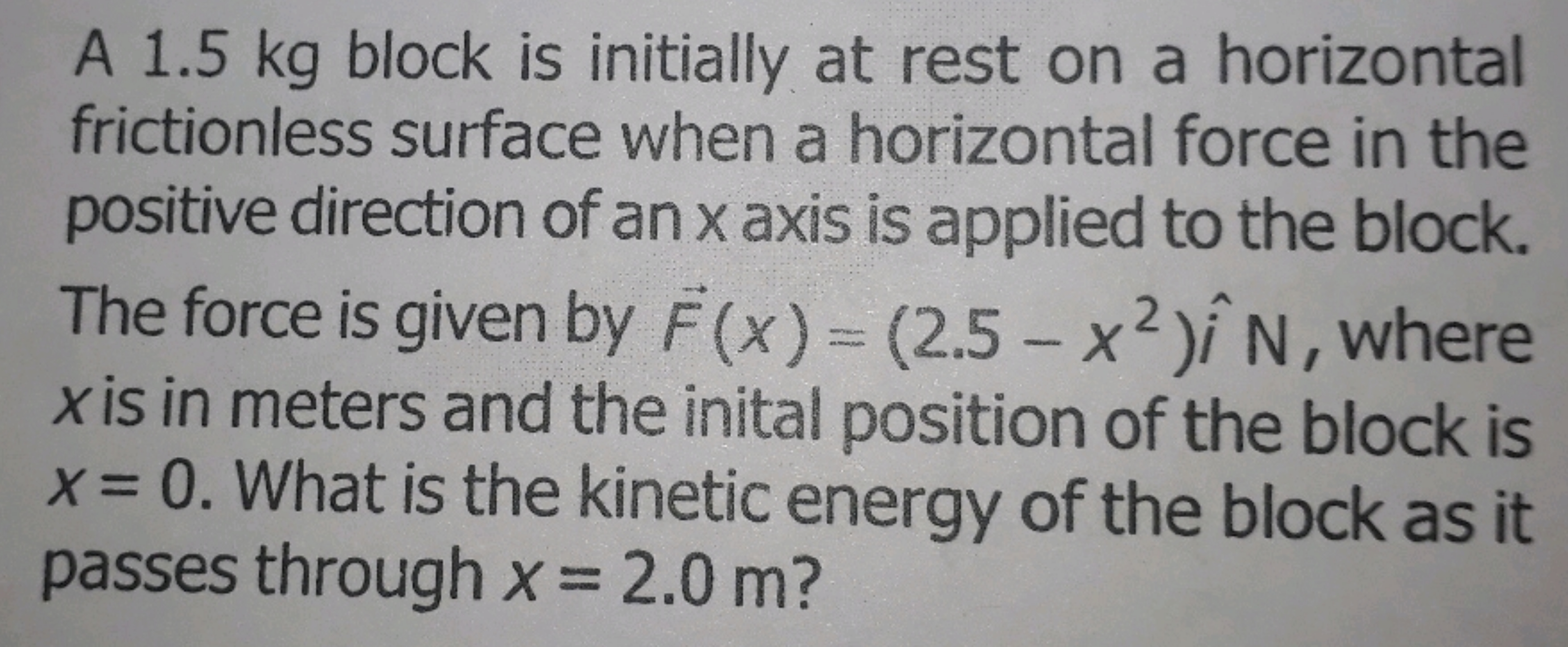 A 1.5 kg block is initially at rest on a horizontal frictionless surfa