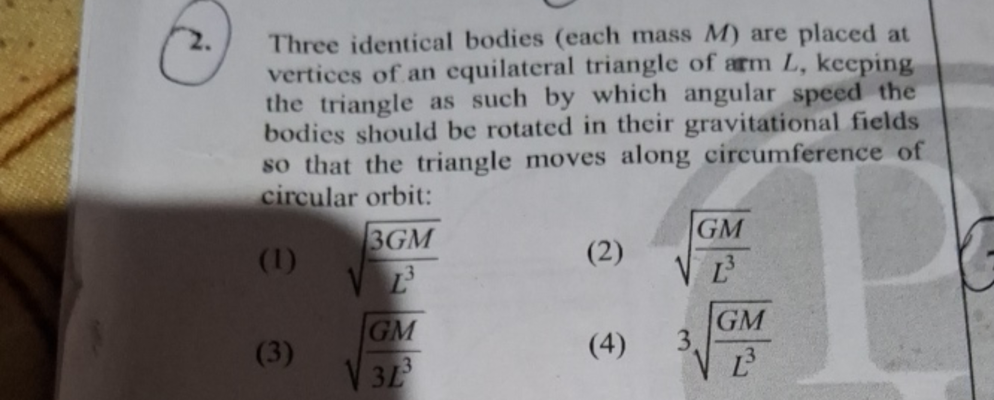 2. Three identical bodies (each mass M ) are placed at vertices of an 