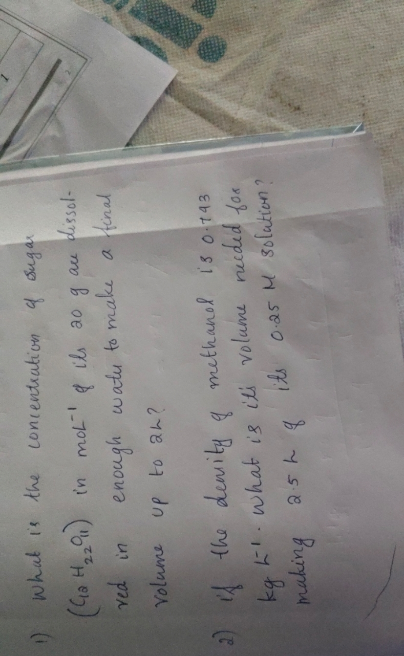 1) What is the concentration of sugar (C12​H22​O11​) in moL−1 \& its 2