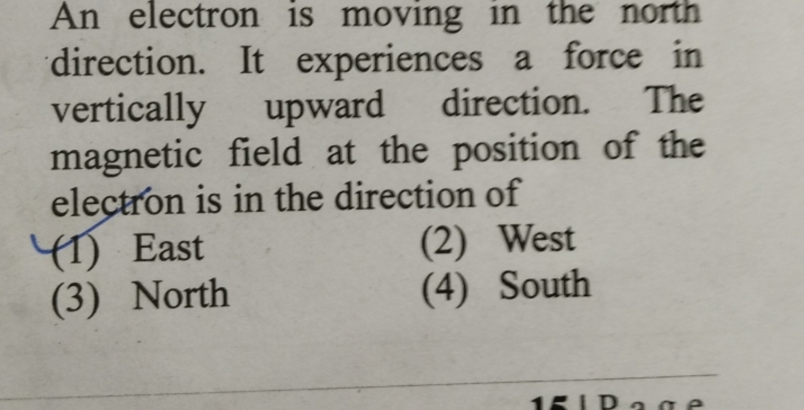 An electron is moving in the north direction. It experiences a force i