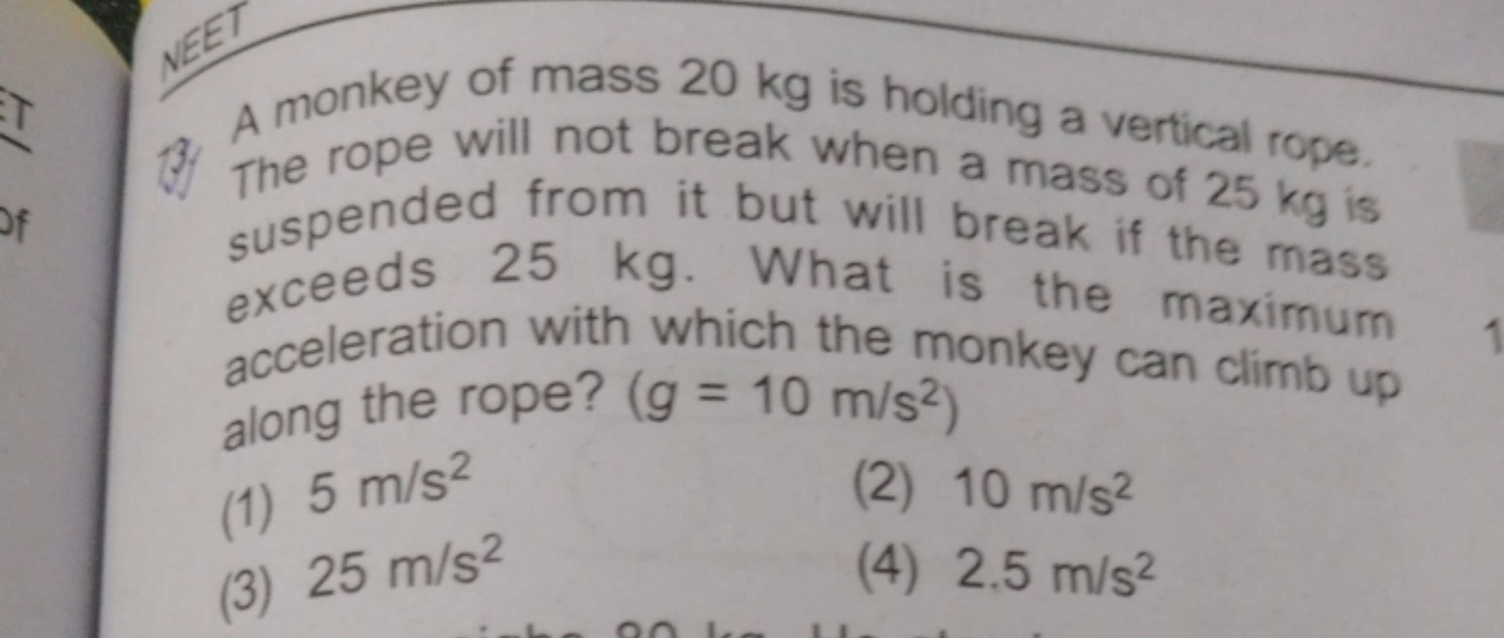 13. A monkey of mass 20 kg is holding a vertical rope. suspended from 