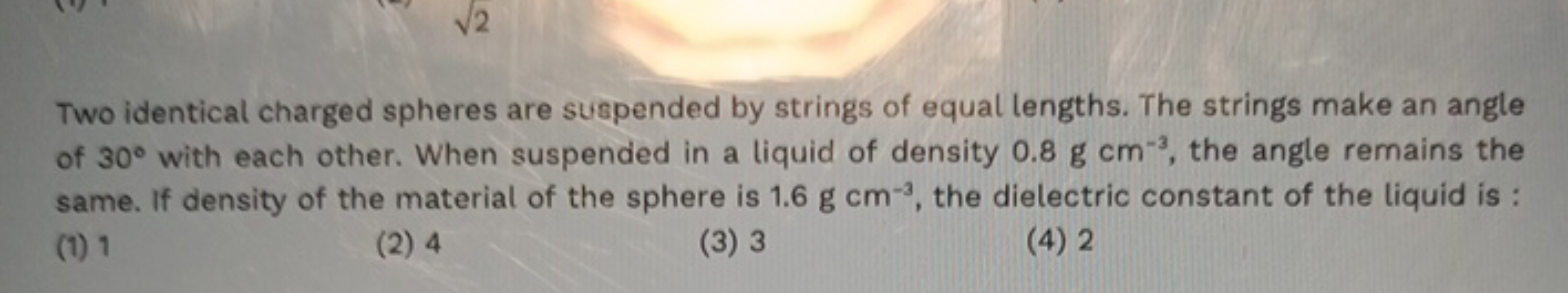 Two identical charged spheres are suspended by strings of equal length